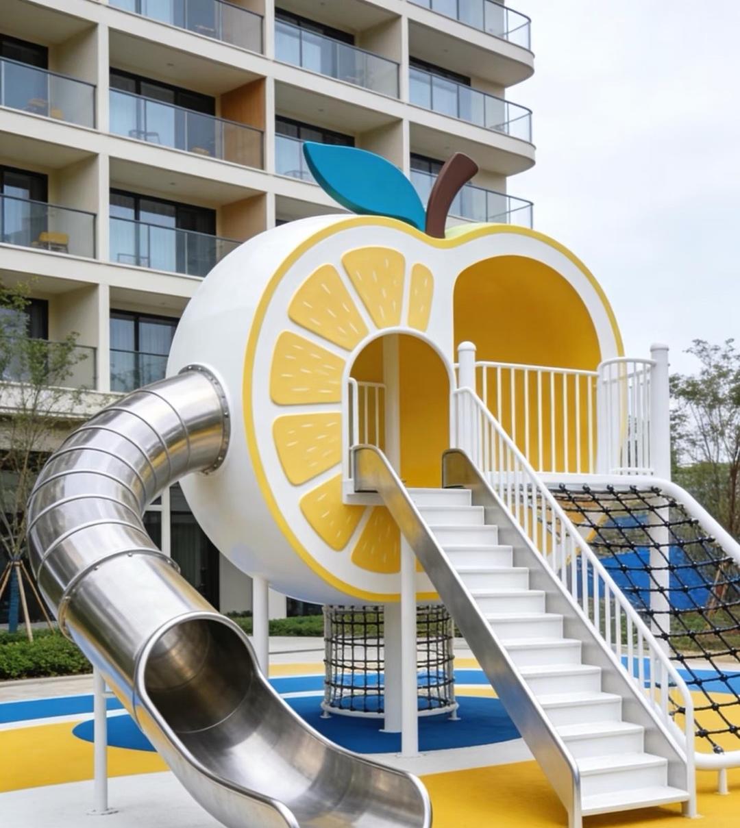 Lemon-themed outdoor play tower with stainless steel slide